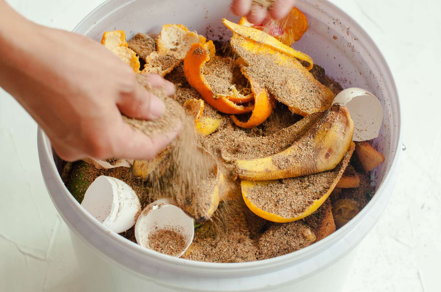 Adding Bokashi to Compost Bin